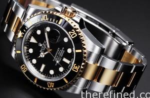 Rolex Submariner steel and gold with black bezel.