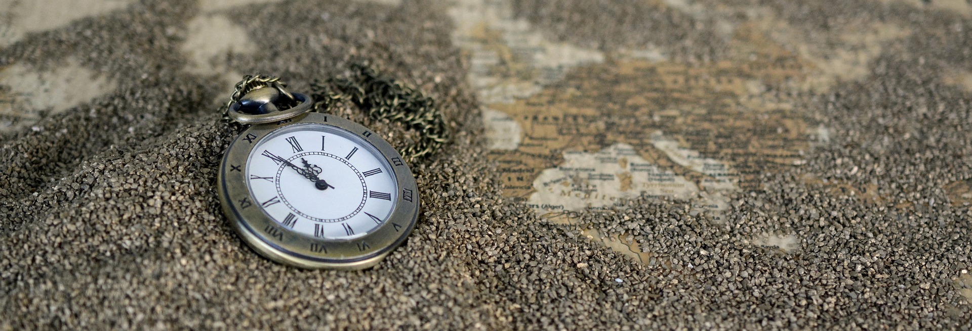 Pocket Watch in the sand