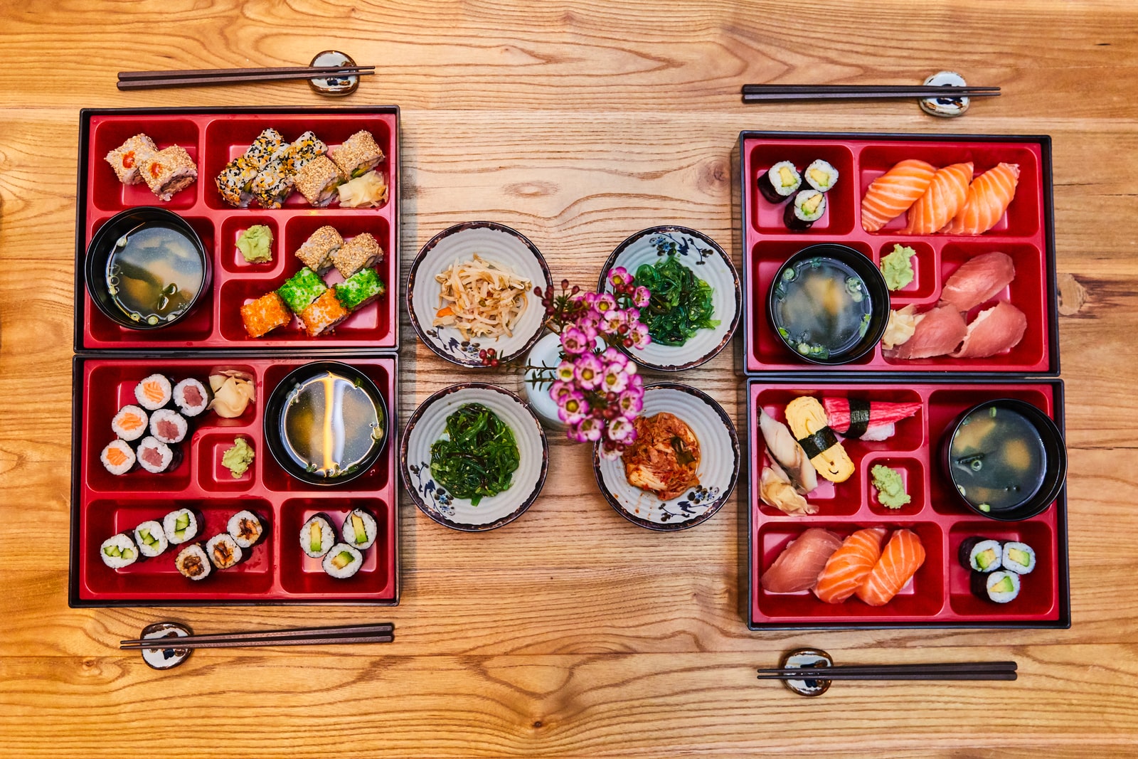 red and green ceramic bowls on brown wooden tray