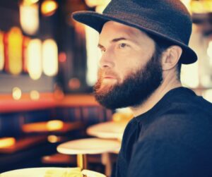 why is it rude to wear a hat at the table