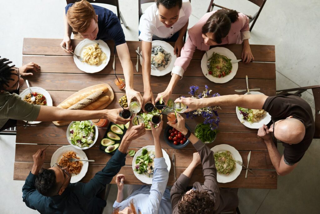 Group of People Making Toast, dinner party