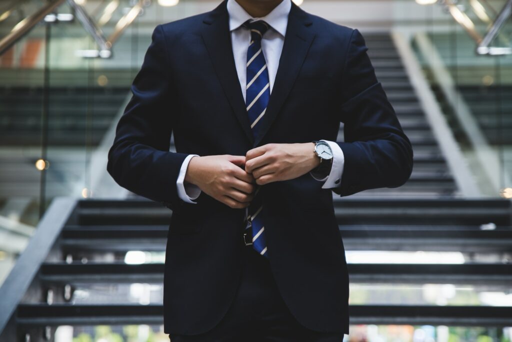 person standing near the stairs, business professional