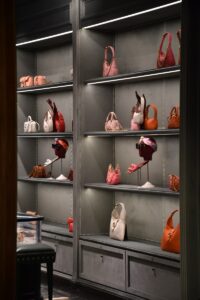 a display case filled with lots of purses