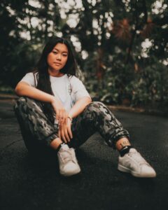 A Woman in White Shirt and Camouflage Pants