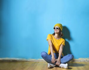 Woman in Yellow Shirt Sitting 