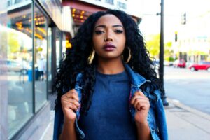 women holding denim jacket