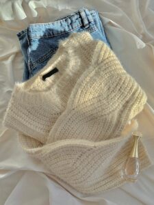 Warm wool sweater paired with classic blue jeans