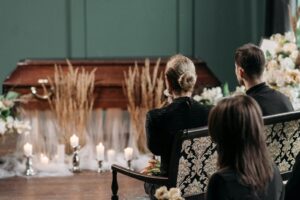 A respectful gathering of family and friends at a funeral service indoors