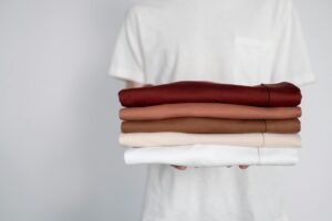 holding linen shirts